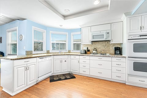 Kitchen comes stocked with dishes, utensils, cookware, bakeware, and all major and small appliances.