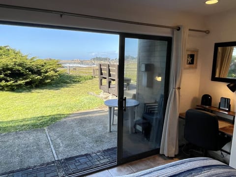 FIRST FLOOR BEDROOM 1, KING BED + DESK. Open slider and take path to bluff trail