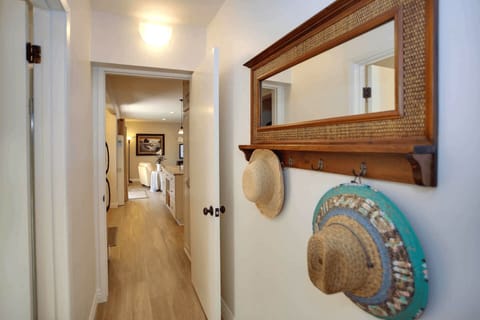 From the main living area, a hallway leads you to the bathroom and bedroom.