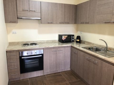 Apartment, 2 Bedrooms, Non Smoking | Private kitchen | Full-size fridge, microwave, oven, stovetop