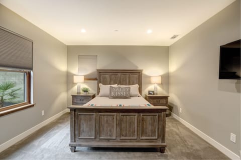 Bedroom 3 has a queen bed, amble dresser and closet clothes storage and SmartTV.