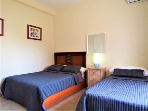 Bedroom Five with King Bed and Single Bed