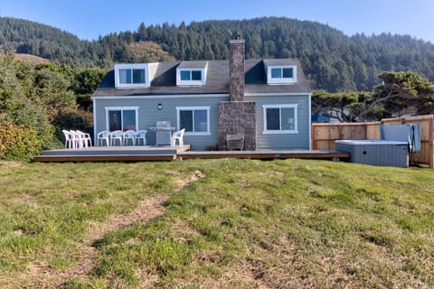 A large grassy area between the house and the beach allows for some privacy from neighbors.