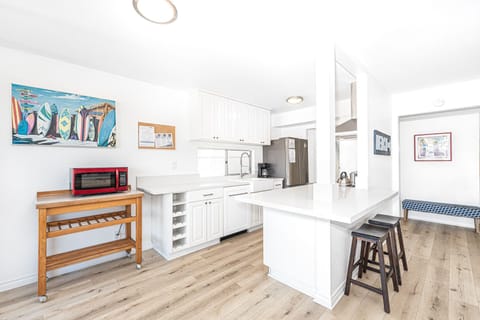 The kitchen opens out to the living area, making meal prep a social affair!
                