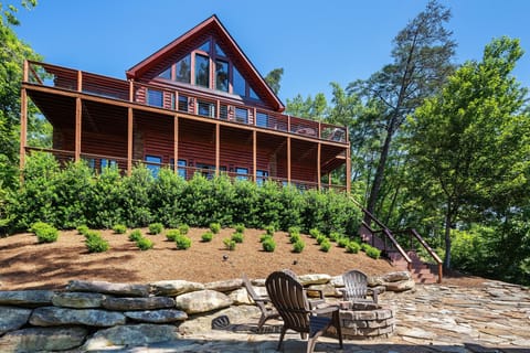 Lake side of the house with fire pit.