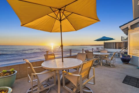 Oceanfront patio w/ 2 dining sets, lounges and fire pit