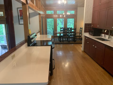 New quartz countertops and farm house sink. Dining room each side of kitchen.