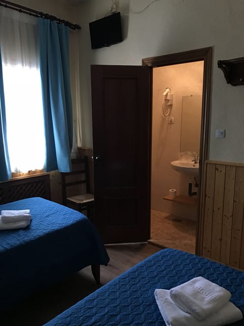 Standard Twin Room | Desk, blackout drapes, iron/ironing board, free WiFi