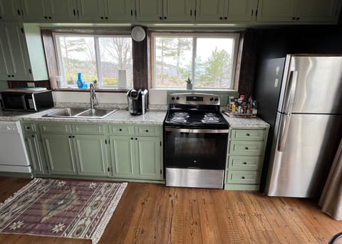 Kitchen Area (Updated Countertops, Stove, Refrigerator, and Sink)
