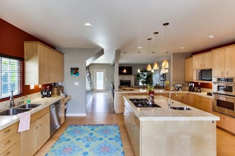 Kitchen with stainless steel appliances, coffee maker, blender, recessed lighting, toaster, blender, and a gas stove