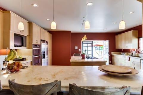 Gorgeous, open, gourmet kitchen with lots of room for all the Chefs and french doors to the backyard