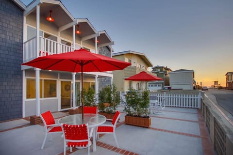 Oversized front ocean view patio is shared with upstairs unit. However, each unit has its own designated BBQ grill and outdoor dining table, seating and umbrella.