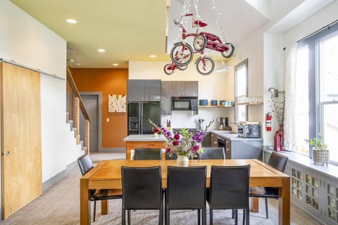 A fun, open and bright welcoming home awaits your visit! Local art adorns the walls & custom furniture provide a true Portland experience