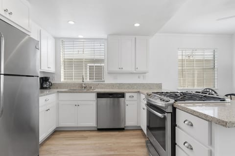 Updated kitchen is fully-stocked with dishes, cooking, baking and meal prep gear. All standard large and small appliances included. See listing description for more supply details.