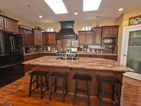 Large gourmet kitchen fully stocked. High end cookware.