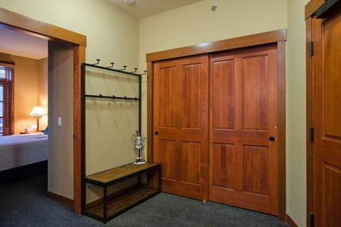 Large entrance with drop zone and guest closet with organizers