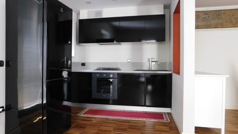 Design Apartment, 2 Bedrooms, 2 Bathrooms, Garden Area | Private kitchen | Full-size fridge, microwave, oven, stovetop