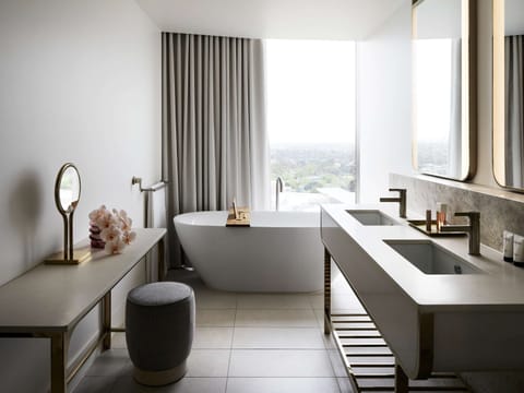 Deluxe Suite, 1 King Bed | Bathroom | Shower, eco-friendly toiletries, hair dryer, bathrobes