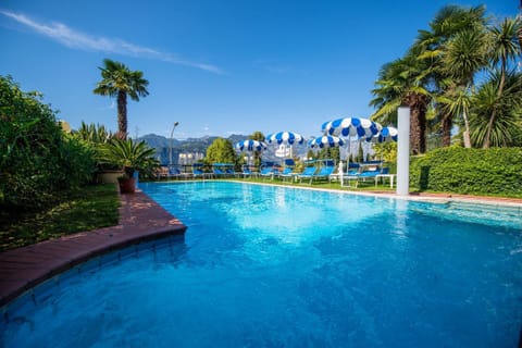 Outdoor pool, open 9:00 AM to 7:00 PM, pool umbrellas, sun loungers