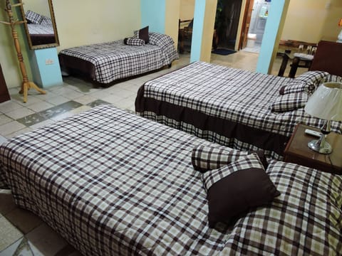 Economy Quadruple Room, Multiple Beds, Non Smoking | Iron/ironing board, WiFi, bed sheets