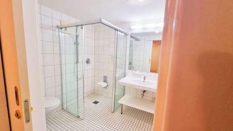 Shower, hair dryer, slippers, towels