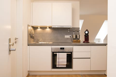 Apartment, 2 Bedrooms | Private kitchen | Fridge, stovetop, dishwasher, coffee/tea maker