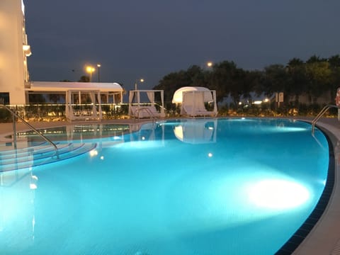 Indoor pool, outdoor pool, open 10:00 AM to 8:00 PM, pool umbrellas