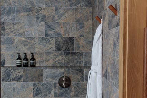 Designer toiletries, hair dryer, bathrobes, towels