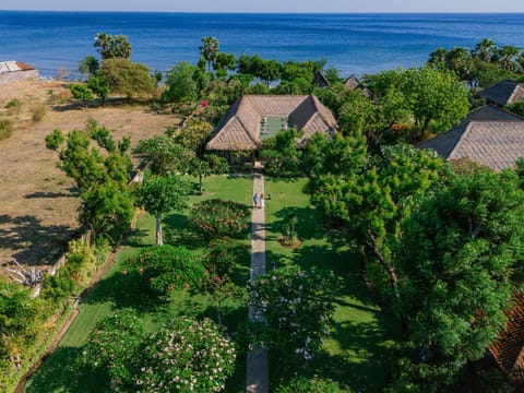 Lush gardens meet the ocean at Villa Wilali.