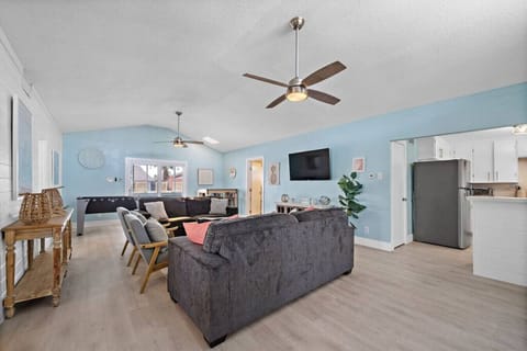 Large open concept living area with flat screen TV