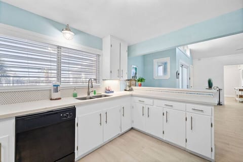 Elevate your dining experience in this well-appointed kitchen, featuring chic bar seating for a casual and inviting atmosphere