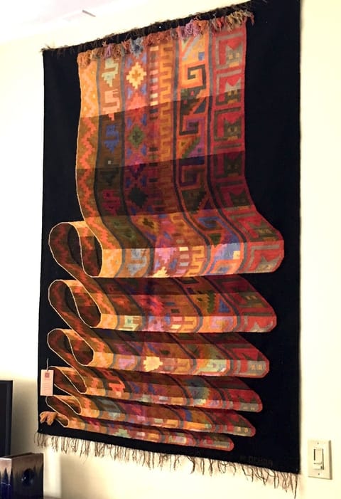 Living room features Peruvian tapestry of a tapestry, strikingly 3 dimensional!