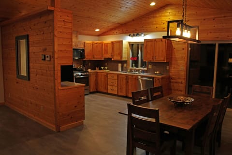 Fully equipped gourmet kitchen. Dining table expands to seat 10