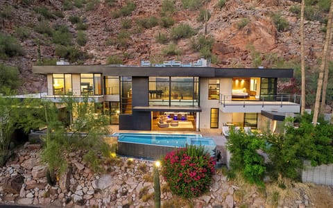 Architectural gem on Camelback with glass walls, rooftop lounge & infinity pool.