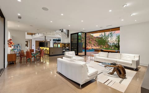 Entertaining areas flow to the pool patio with curated art & natural light.
