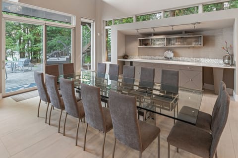 Dining for 14, plus additional seating at breakfast bar, sunken bar and outside.