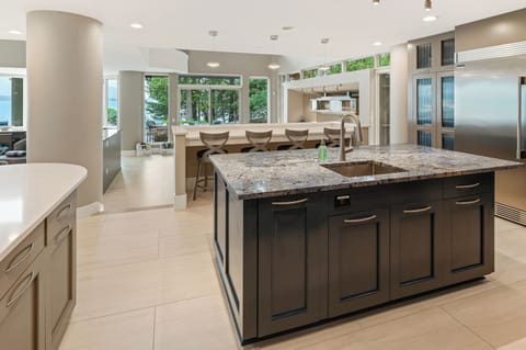 Breakfast bar overlooks dining table below.