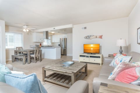 View of spacious living, dining and kitchen areas. The bright and sunny upper unit nicely accommodates a maximum of 10 guests.