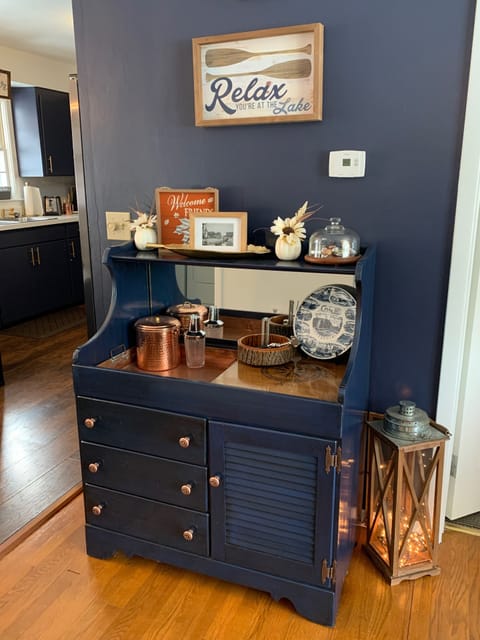 Dry bar with copper well and ice bucket for all your libation needs. 