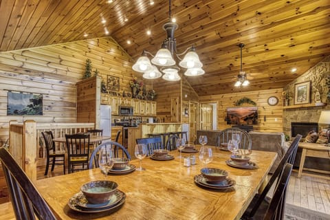 Cabin with a View in Pigeon Forge "Getaway Mountain Lodge" - Dining table, living room, and fully furnished kitchen