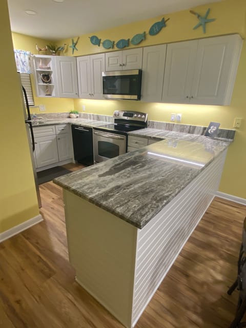 New Kitchen Cabinets, Granite, Microwave & Larger Refrigerator thanks to Sally!