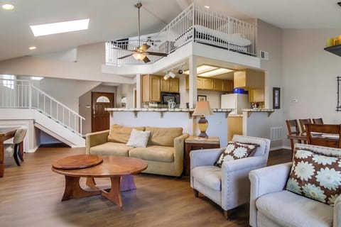 Open style floor plan with kitchen, dining area, living room and upstairs loft