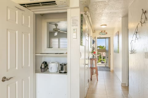 In direct path of Trade Winds that flow into the bedroom through custom cutout.