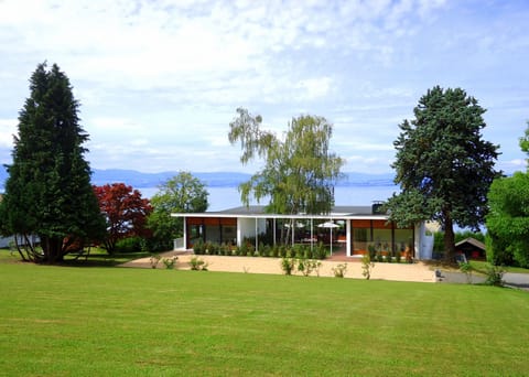 Mid Century Modern Villa with Lake Views, surrounded by large garden
