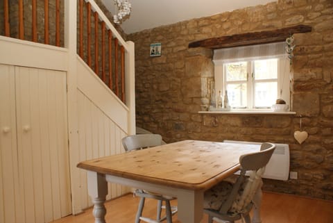 Kitchen dining with stairs to bedroom