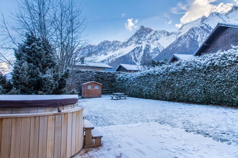 Relax in the cedarwood hot tub whilst looking onto the Mont Blanc Massif