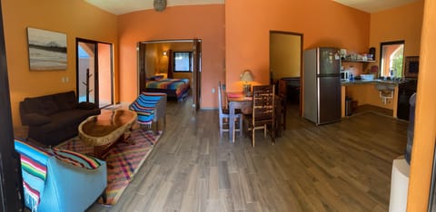 Wide angle view of kitchen and living room