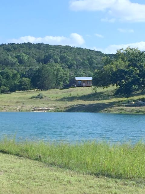View of cabin from across the lake