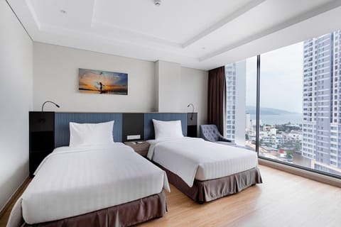 Deluxe Room, 2 Twin Beds, Sea View | Minibar, in-room safe, desk, blackout drapes