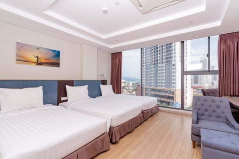 Family Suite, City View | Minibar, in-room safe, desk, blackout drapes